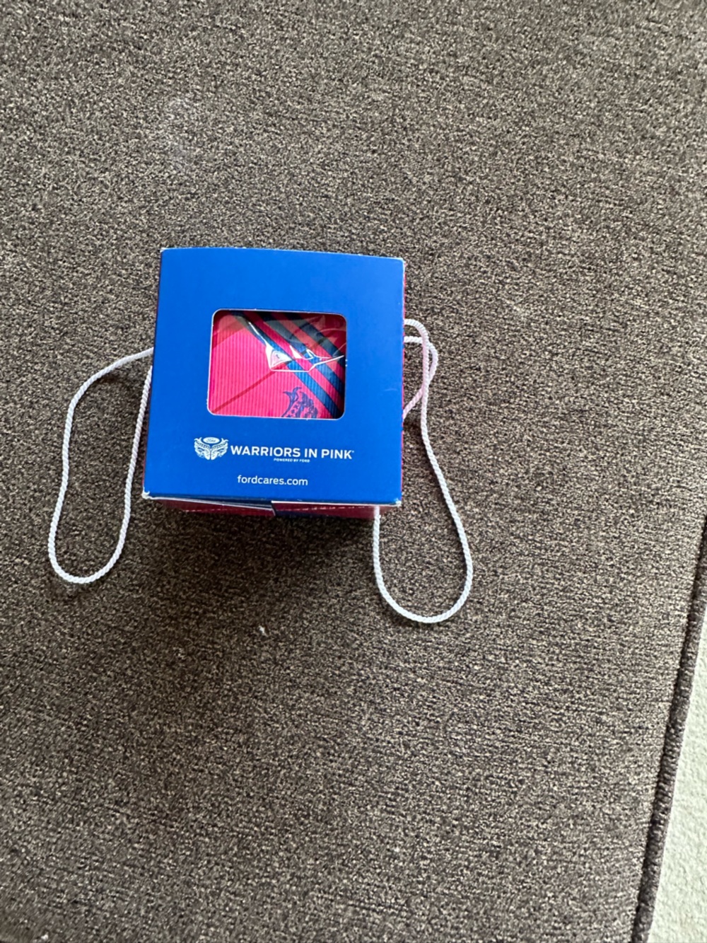 Ford blue gift box with pink item for cancer support